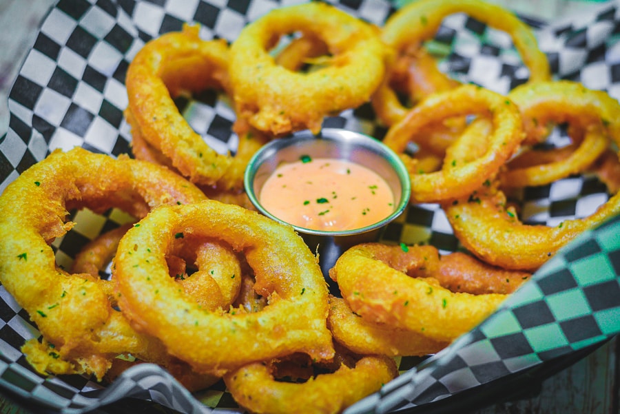 Eatz Grill golden fried onion rings with dipping sauce